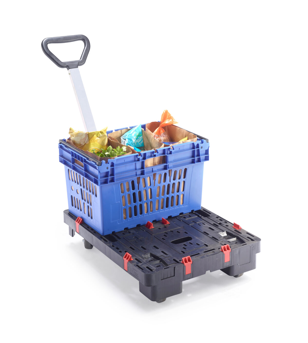 A Tosca half dolly with an attached handle sits in a store aisle with a picking tote secured on top, filled with groceries.