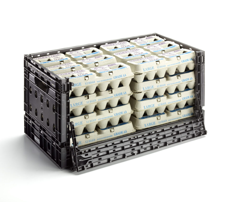 A black, custom-made reusable egg crate by Tosca, created specifically for the egg industry. It features a drop-down front for easy product selection and a retail-ready design for storing and restocking shelves.