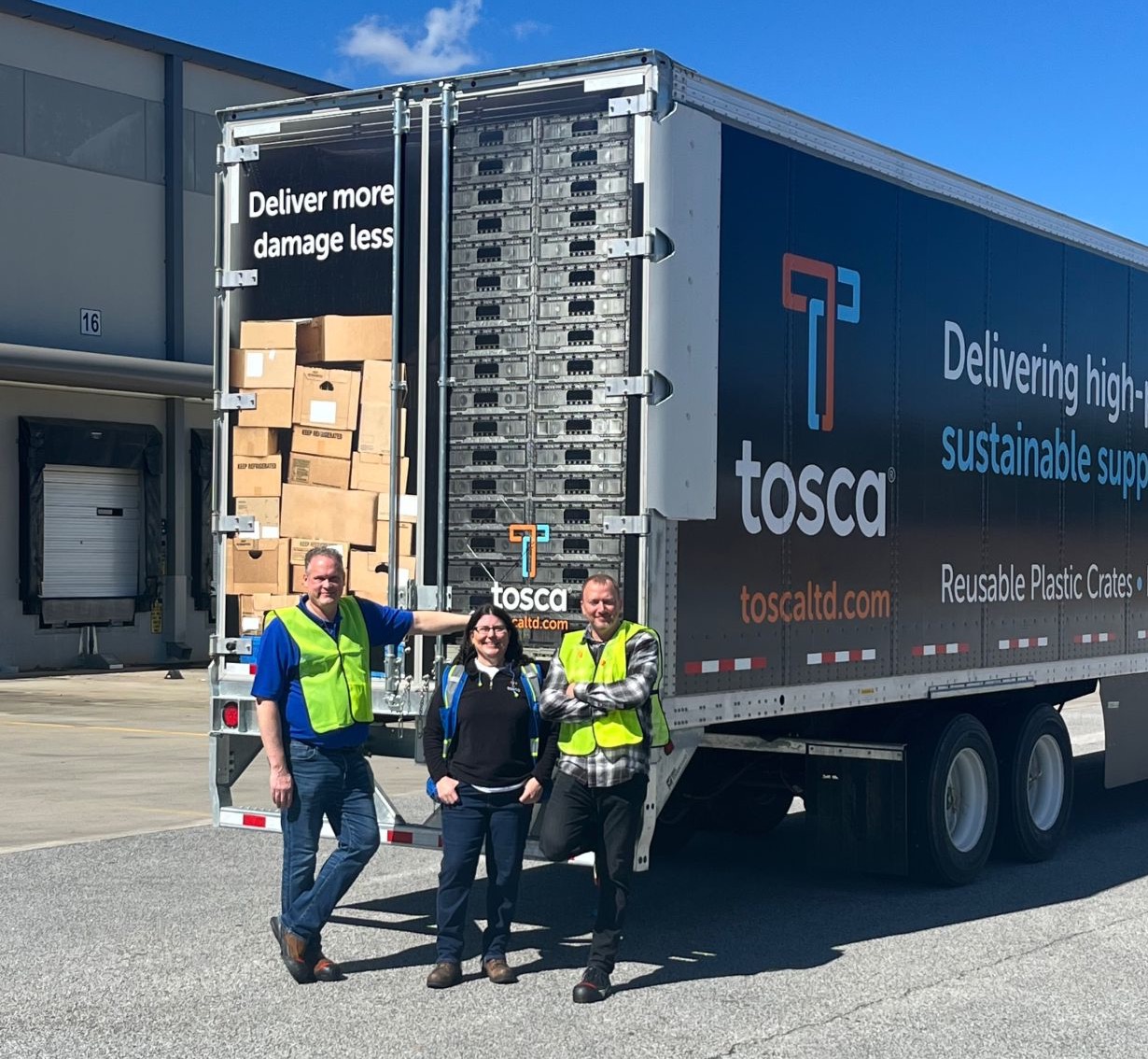 Tosca employees standing next to a Tosca truck